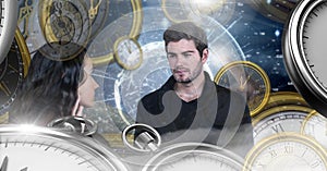 Couple in surreal time and space with clocks