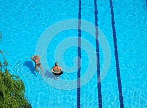 Couple swimming pool