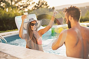 Couple at the swimming pool party