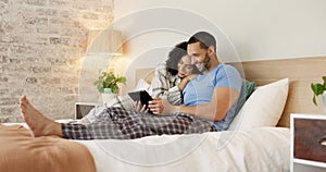 Couple, tablet and relax in home bedroom, laugh or morning with video, movie or meme for love, care or hug. Man, woman