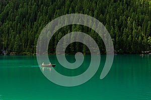 Couple takes a rowboat ride on Lake Braies