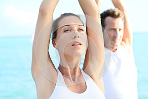 Couple taking a deep breath at yoga excercising
