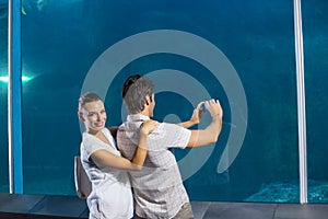 Couple taking photo of shark