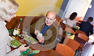 Couple taking photoes of meal
