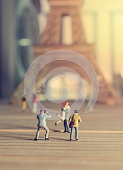 Couple in taking picture with eiffel tower