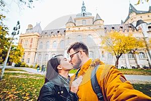 Couple taking selfie in front of castle
