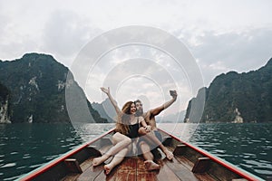 Couple taking selfie on a longtail boat