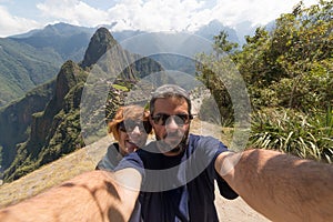 Couple taking selfie at Machu Picchu, Peru