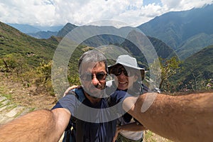 Couple taking selfie at Machu Picchu, Peru