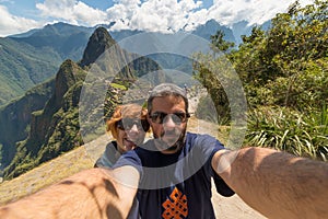 Couple taking selfie at Machu Picchu, Peru