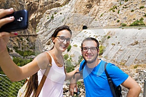 Couple taking a selfie in mountainous place