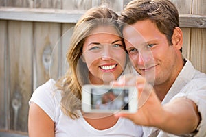 Couple taking selfie with phone