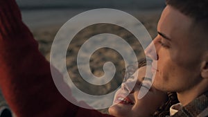 Couple taking selfie photo sunrise sea beach. Lovers flirting with each other