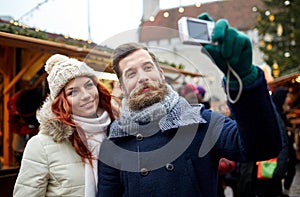 Couple taking selfie with smartphone in old town