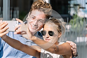 Couple taking a selfie on a terrace