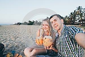 Couple taking selfie at tropical beach in Sri Lanka