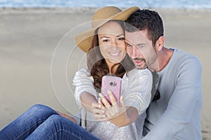 Couple taking selfie on winter break