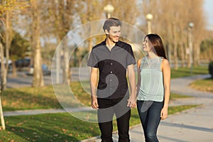 Couple taking a walk in a park photo