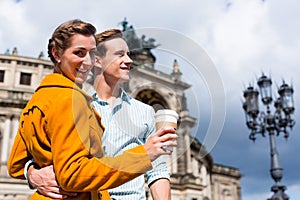 Couple taking walk at Semperoper in Dresden