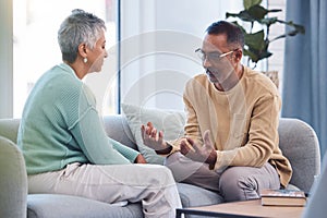 Couple, talking and conversation during fight on sofa about marriage problems, conflict and communication. Divorce