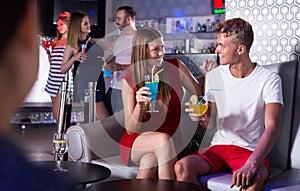 couple talking with drinks in the hand