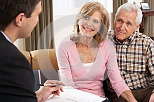 Couple Talking With Financial Advisor
