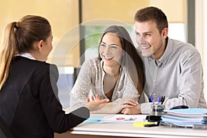 Couple talking with a real estate agent