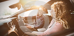 Couple talking while sitting in car