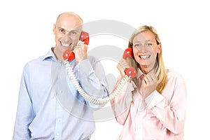 Couple talking on telephone