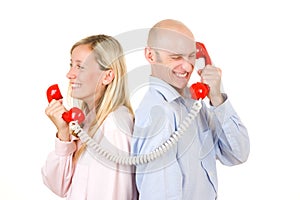 Couple talking on telephone