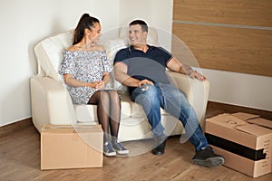 Couple talking to each other after unpacking