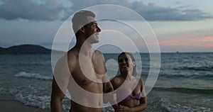 Couple Talking Walking On Beach Holding Hands After Sunset Happy Man And Woman Together On Seaside During Vacation