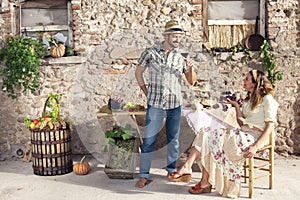 Couple talking about wine in an old farm