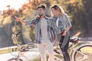 Couple with a tandem bicycle