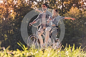 Couple with a tandem bicycle