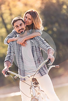 Couple with a tandem bicycle