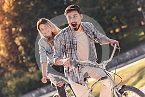 Couple with a tandem bicycle