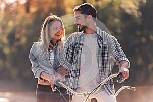 Couple with a tandem bicycle