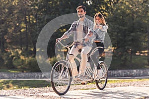 Couple with a tandem bicycle