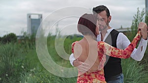 A couple of tango dancers dancing in touristic spots of Buenos Aires