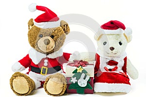 Couple teddy bear doll wearing santa set with many colorful red gift box isolated on white background,Christmas day and New Year`