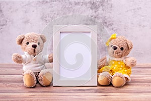 Couple teddy bear with Picture frame on table wooden. Valentine`s Day celebration