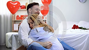 Couple tenderly cuddling, male and lady celebrating st Valentines day together