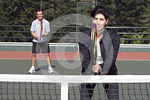Couple on Tennis Court - horizontal