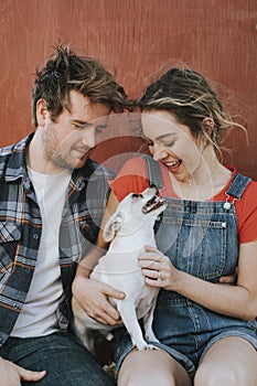 Couple with their adopted Chihuahua dog