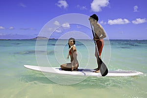 Couple with their paddle board