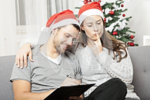 Couple think about to do list for christmas