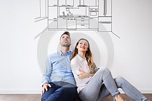 Couple Thinking To Buy New Kitchen For House