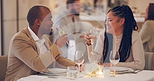 Couple, toast and celebration for date in restaurant, conversation and bonding for love. Black woman, people smile and