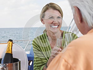 Couple Toasting Champagne On Yacht